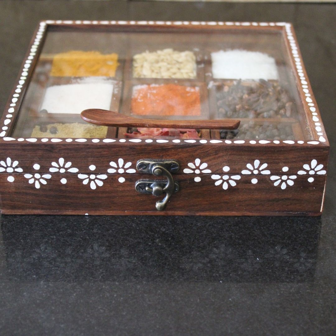 Sheesham wood handcrafted and hand painted wooden spice box / masala dani with nine removable partitions.