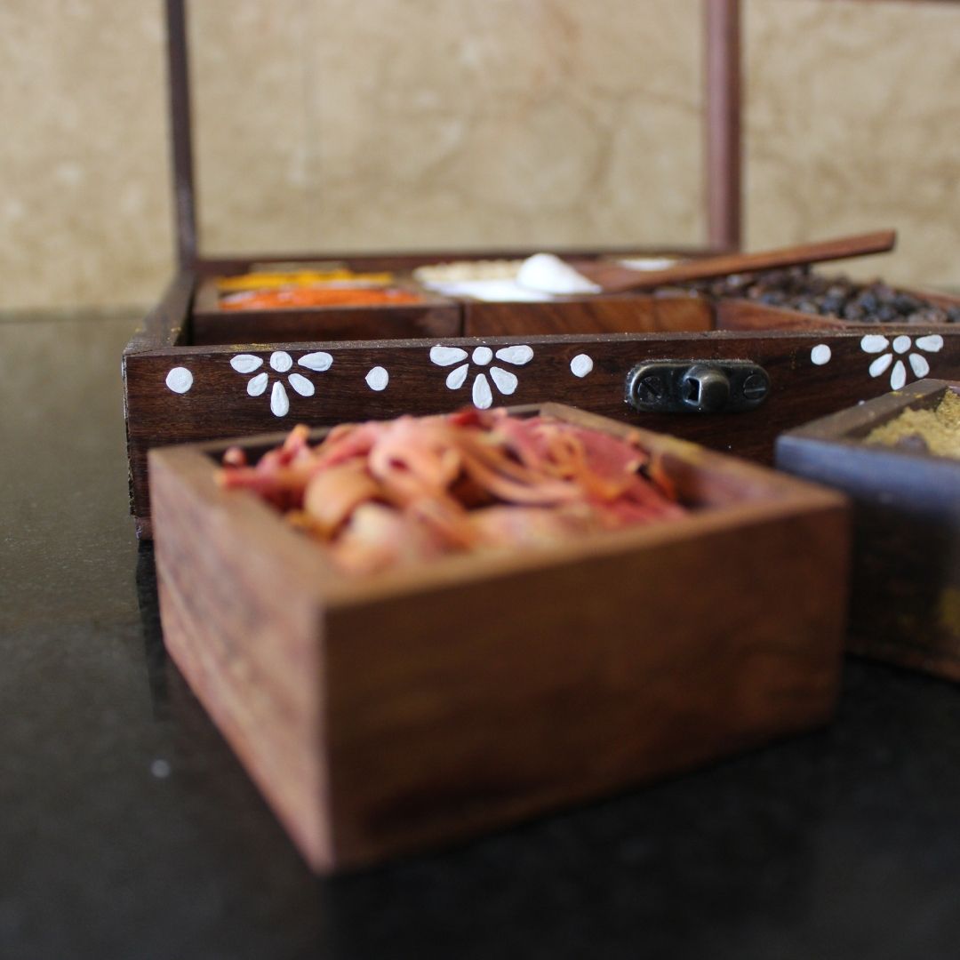 Sheesham wood handcrafted and hand painted wooden spice box / masala dani with nine removable partitions.