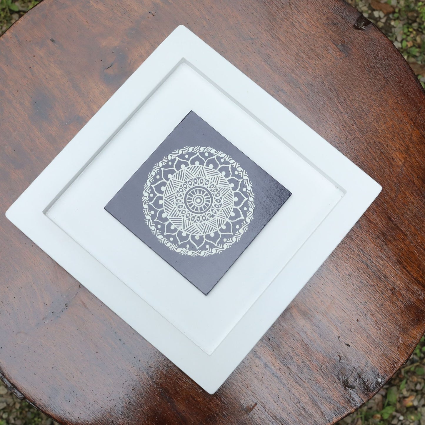 Blue And White Colored Hand Painted Kumouni Aipan Inspired Wall Decor in White MDF Frame.