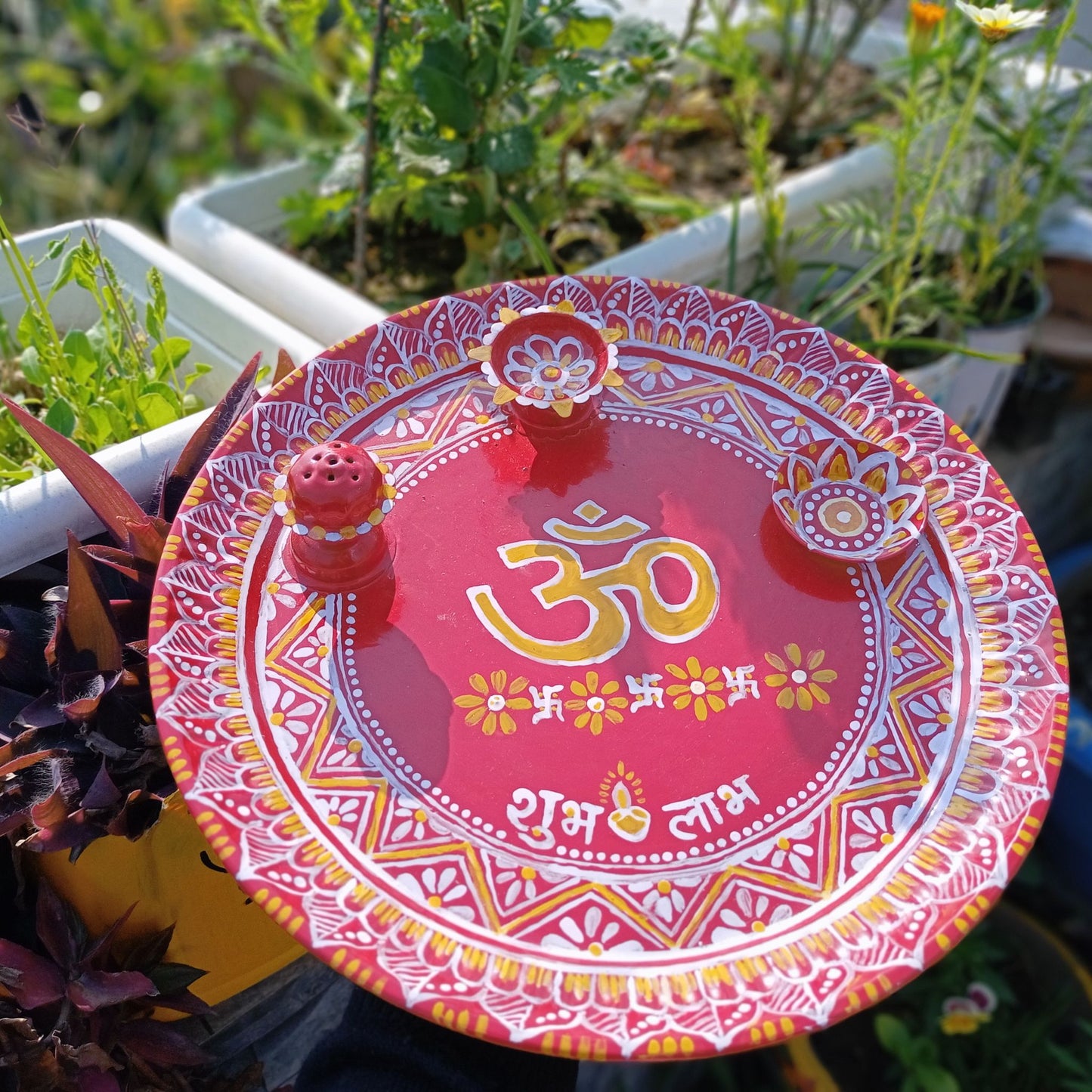 Large Size Hand Painted Puja Thalis for all occasions. Whether its Diwali, Bhaiya Dooj, Karwa Chauth, these hand painted aipan inspired puja thalis would be the perfect addition to your decor. Has different partitions each for diya/ lamp, tika / roli, chawal / rice and agarbatti too.