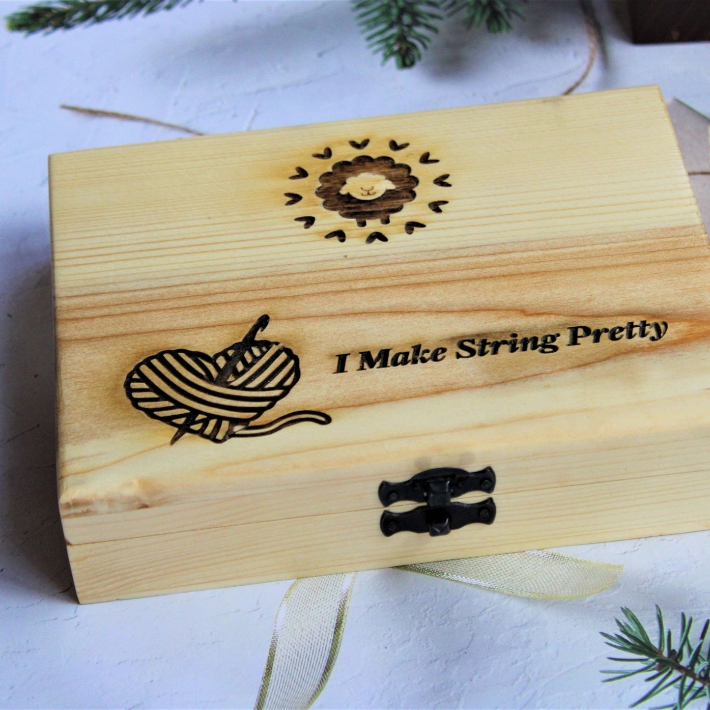 Sheesham or Indian Rosewood crochet hooks with I make String Pretty Crochet Storage Box. The hooks come in a set of 7 and are accompanied by a storage box. The hooks are made of sheesham or Indian Rosewodd while the box is laser engraved and material used for the box is Pinewood.
