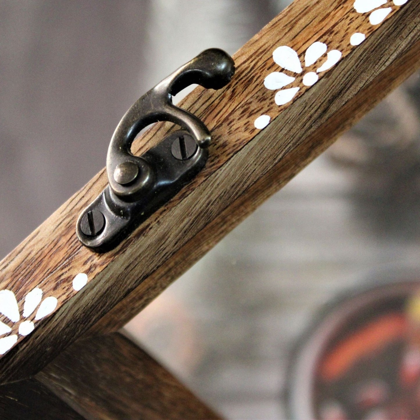 Handcrafted and Hand Painted Mango Wood Spice box with 12 large partitions and glass top. Brass Lock closeup view