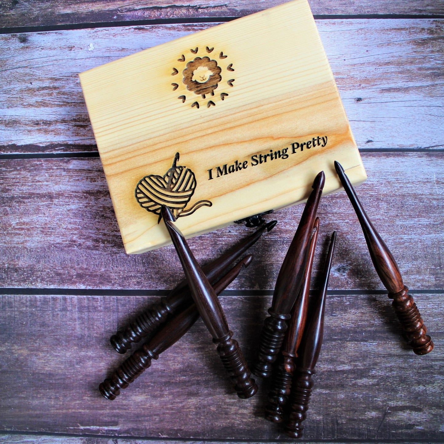 Sheesham or Indian Rosewood crochet hooks with I make String Pretty Crochet Storage Box. The hooks come in a set of 7 and are accompanied by a storage box. The hooks are made of sheesham or Indian Rosewodd while the box is laser engraved and material used for the box is Pinewood.