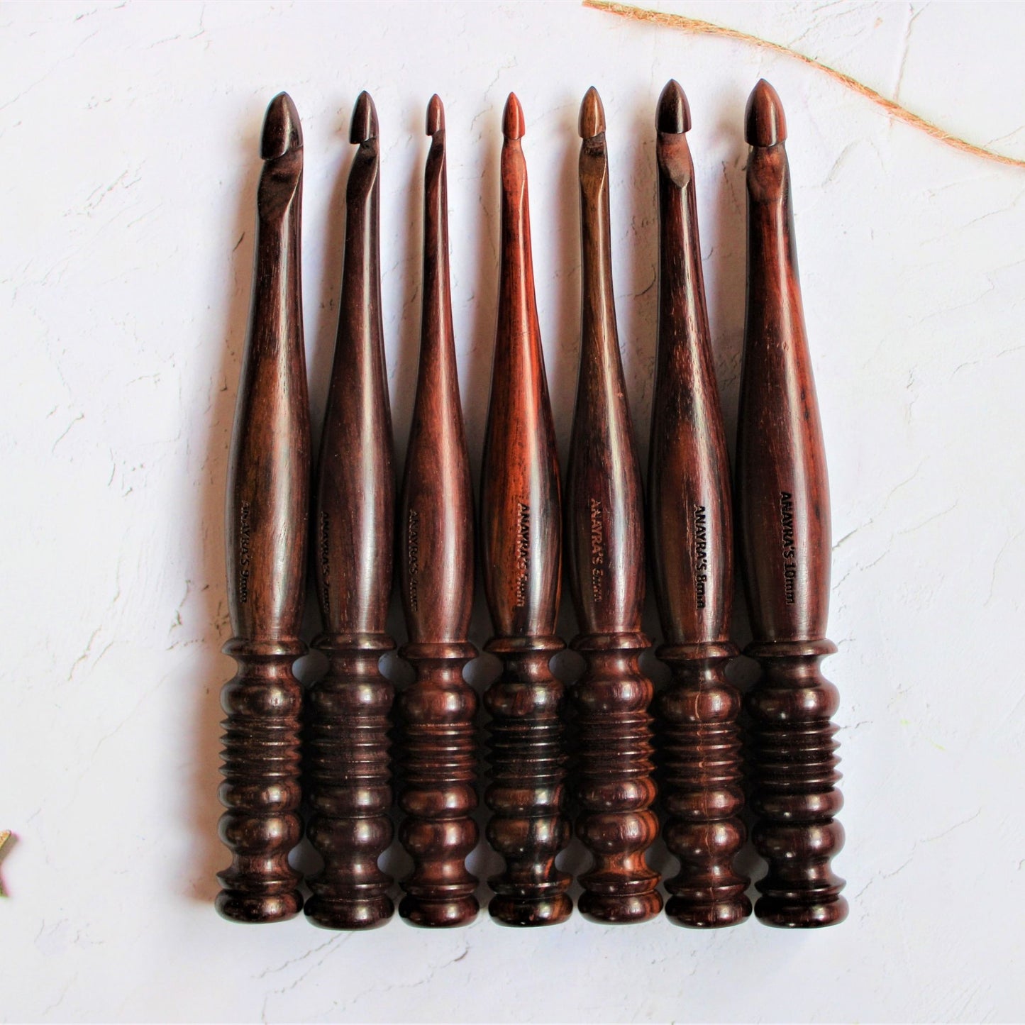 Sheesham or Indian Rosewood crochet hooks with I make String Pretty Crochet Storage Box. The hooks come in a set of 7 and are accompanied by a storage box. The hooks are made of sheesham or Indian Rosewodd while the box is laser engraved and material used for the box is Pinewood.