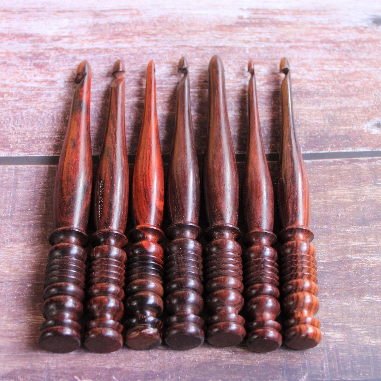 Sheesham or Indian Rosewood crochet hooks with I make String Pretty Crochet Storage Box. The hooks come in a set of 7 and are accompanied by a storage box. The hooks are made of sheesham or Indian Rosewodd while the box is laser engraved and material used for the box is Pinewood.