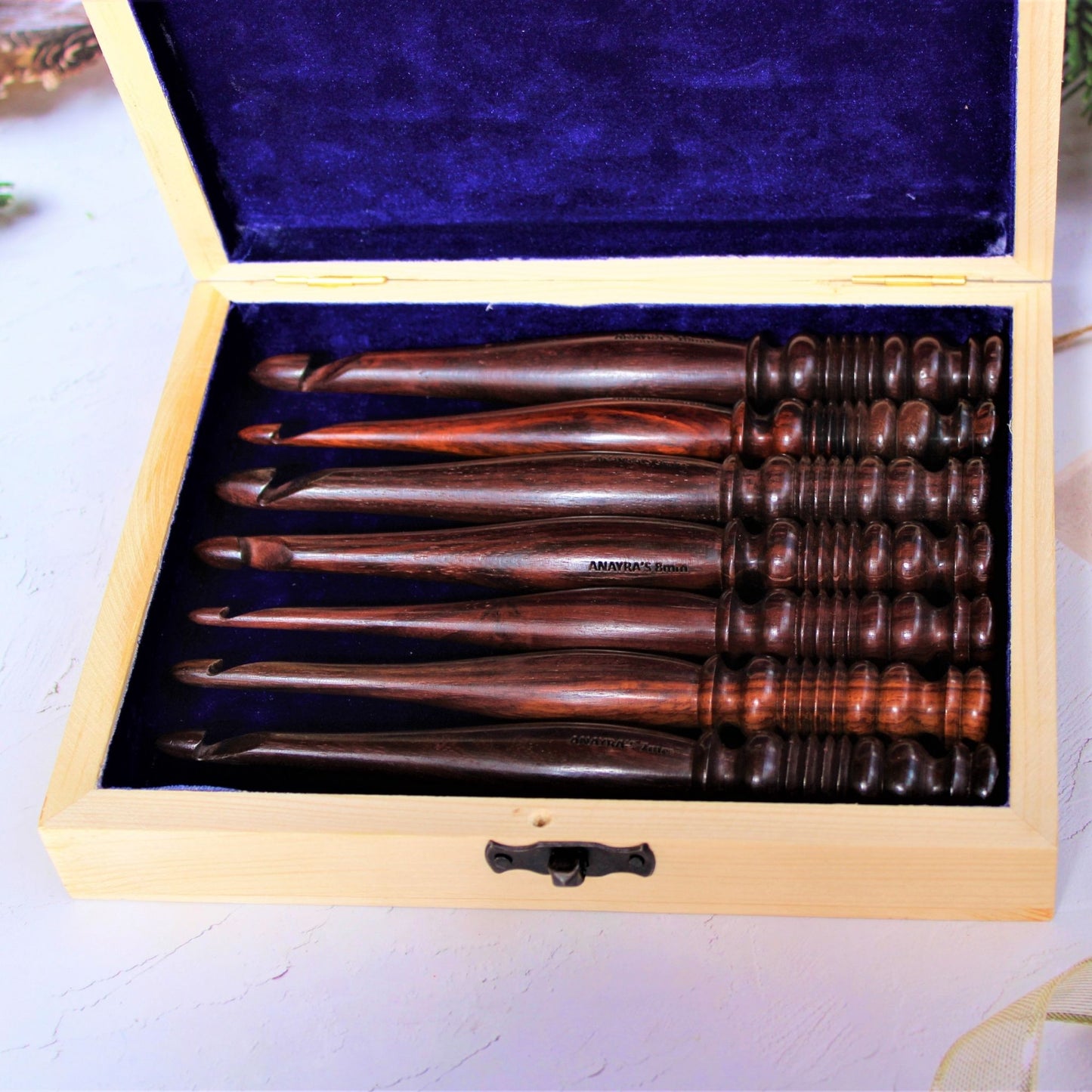Sheesham or Indian Rosewood crochet hooks with I make String Pretty Crochet Storage Box. The hooks come in a set of 7 and are accompanied by a storage box. The hooks are made of sheesham or Indian Rosewodd while the box is laser engraved and material used for the box is Pinewood.