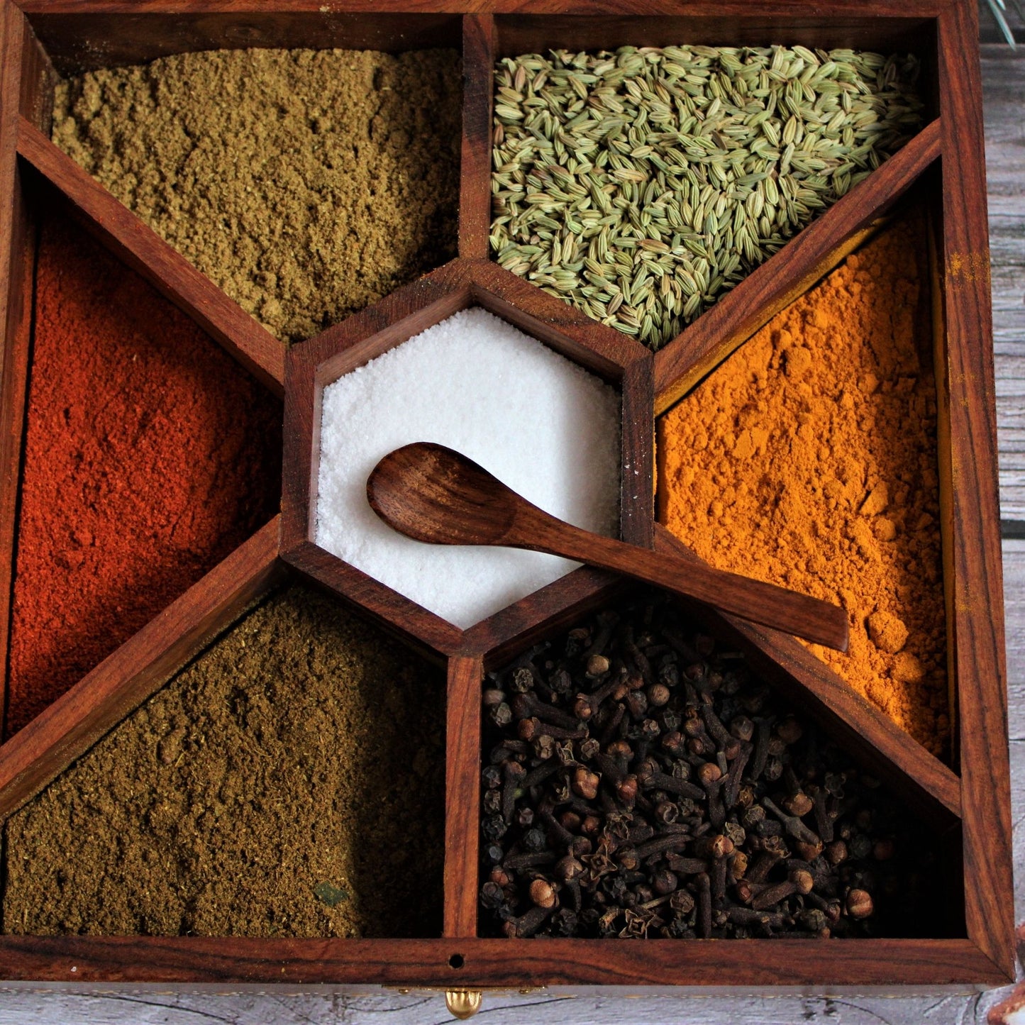 Aipan Inspired Hand Painted and Handcrafted Wooden Spice Storage Box with Glass Top and Free Wooden Spoon. Showcase Your Spices and other condiments with style. Alternatively Store Tea Bags, Dry Fruits and other condiments of the kitchen.