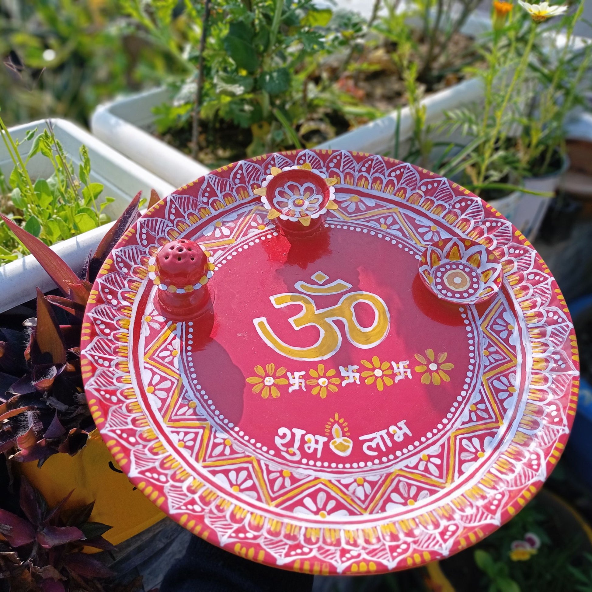 Large Size Hand Painted Puja Thalis for all occasions. Whether its Diwali, Bhaiya Dooj, Karwa Chauth, these hand painted aipan inspired puja thalis would be the perfect addition to your decor. Has different partitions each for diya/ lamp, tika / roli, chawal / rice and agarbatti too. 