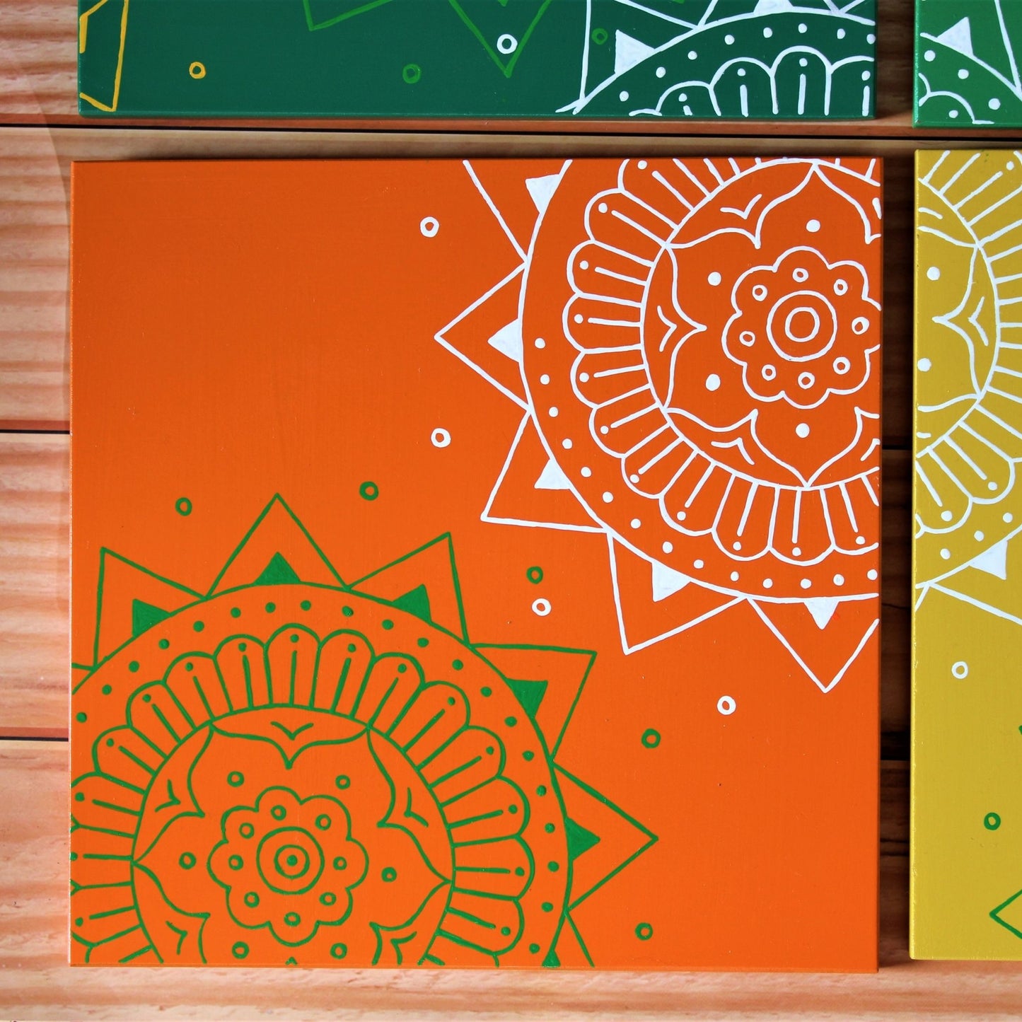 Kumouni Aipan Inspired Wall Frame Tile Handpainted in Green, white and Orange Colors.