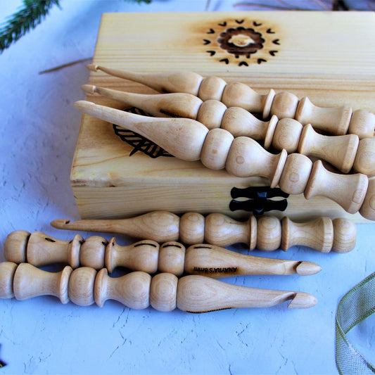 Closeup image of all the crochet hooks with the box.